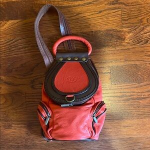 Red and Brown Compact Backpack with Smooth Texture